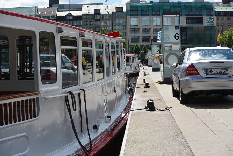One of the Alsterdampfer sightseeing boats tied up at the Jungfernstieg quay in Hamburg