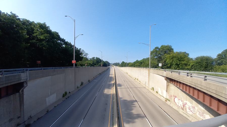 The Amstutz Expressway heading north at Grand Avenue in Waukegan, Illinois — the empty lakefront road that played the Dan Ryan.