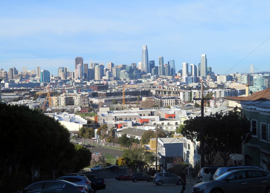 The downtown skyline standing up behind Potrero Hill — the background that made the block worth filming.