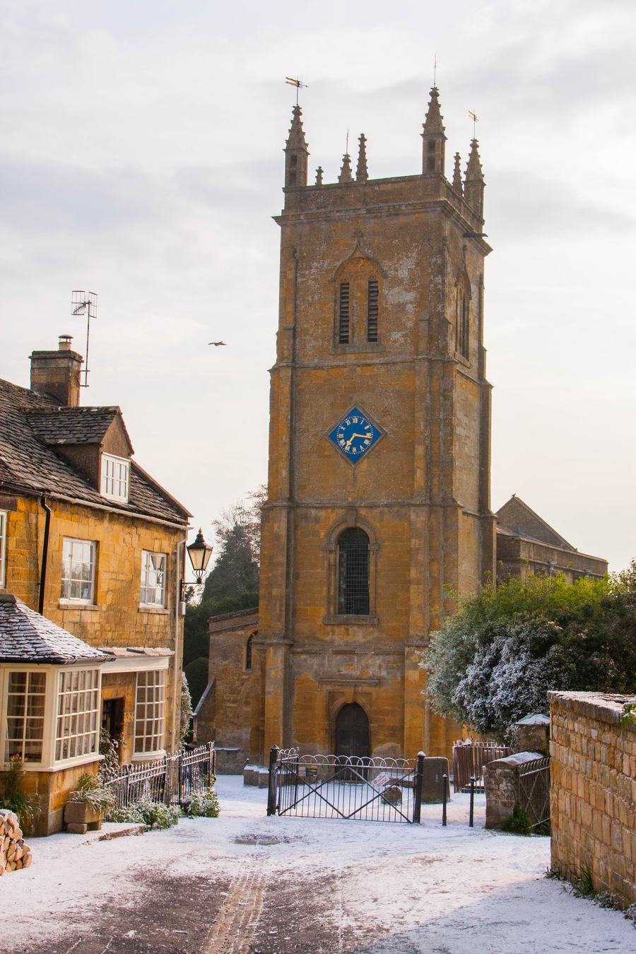 Blockley churchyard and lane covered with artificial snow during filming