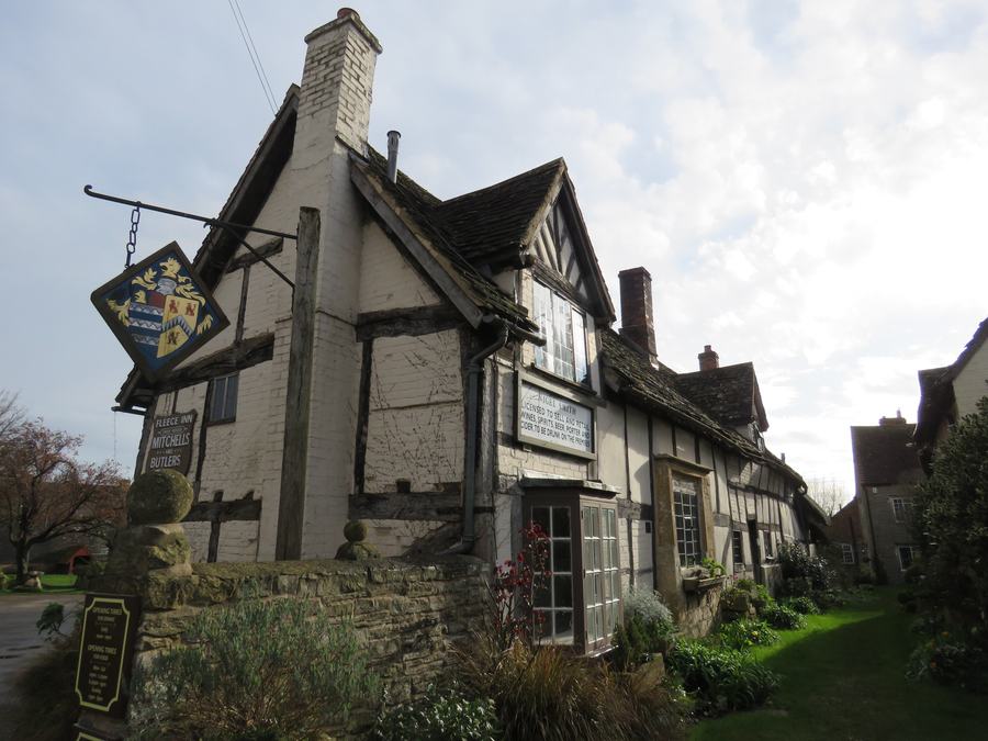 Half-timbered front of The Fleece Inn at Bretforton with its hanging sign