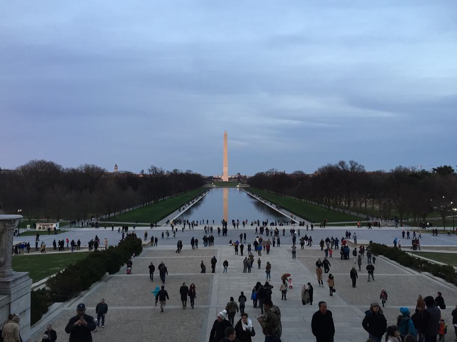 Crowd on the plaza below the Lincoln Memorial looking east along the Reflecting Pool