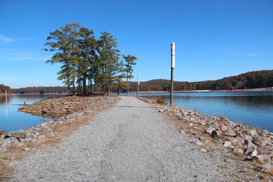 Wooden jetty reaching into Lake Allatoona in autumn