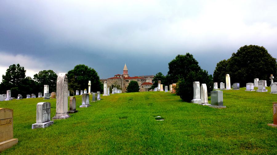 Westview Abbey mausoleum seen across the cemetery lawn
