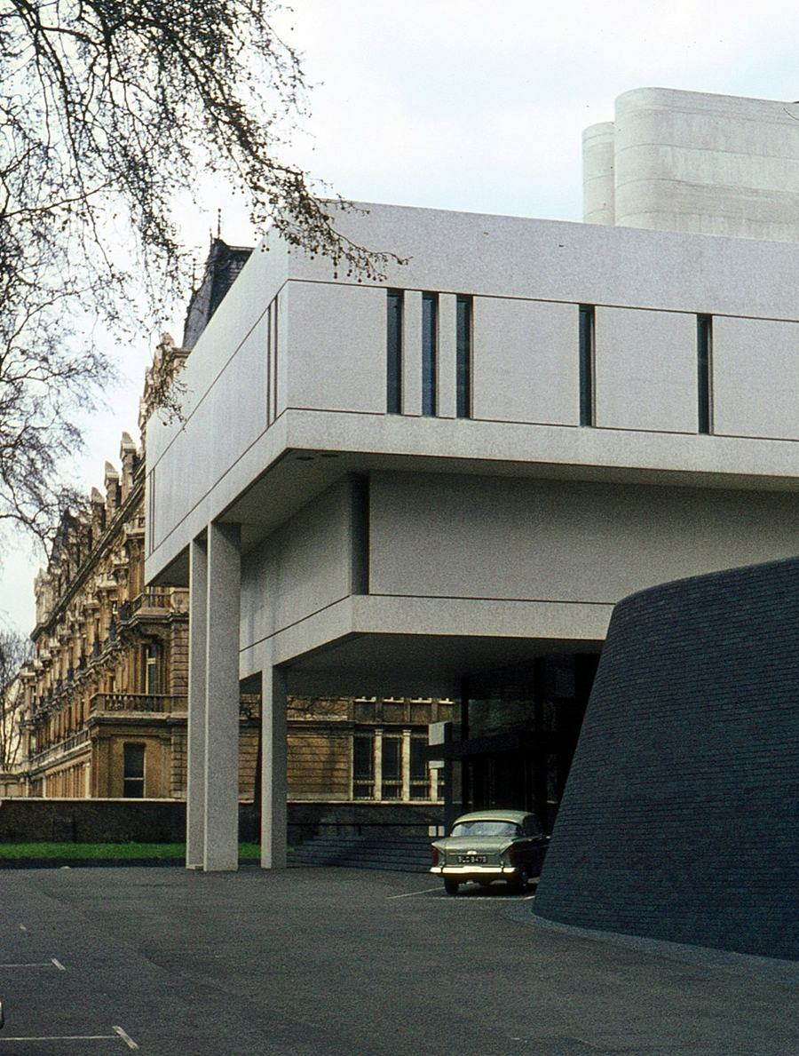 The Royal College of Physicians photographed in 1966, two years after it opened, with a period car parked on the forecourt and the older terrace of Regent's Park beside it.