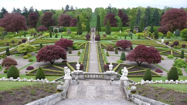 Formal parterre garden at Drummond Castle seen from the terrace, with clipped yews and a central path