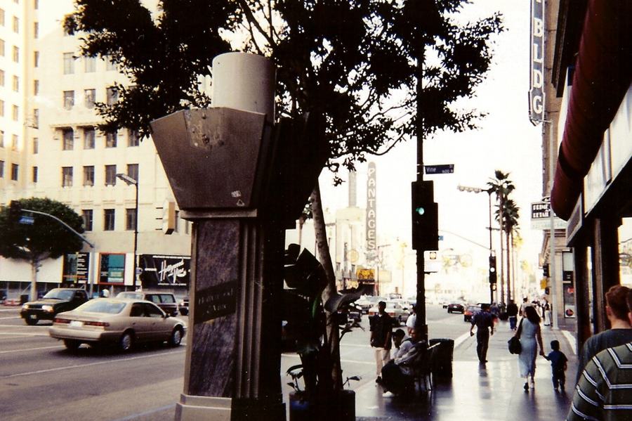 Street view east along Hollywood Boulevard from Vine Street with the Pantages sign in the distance
