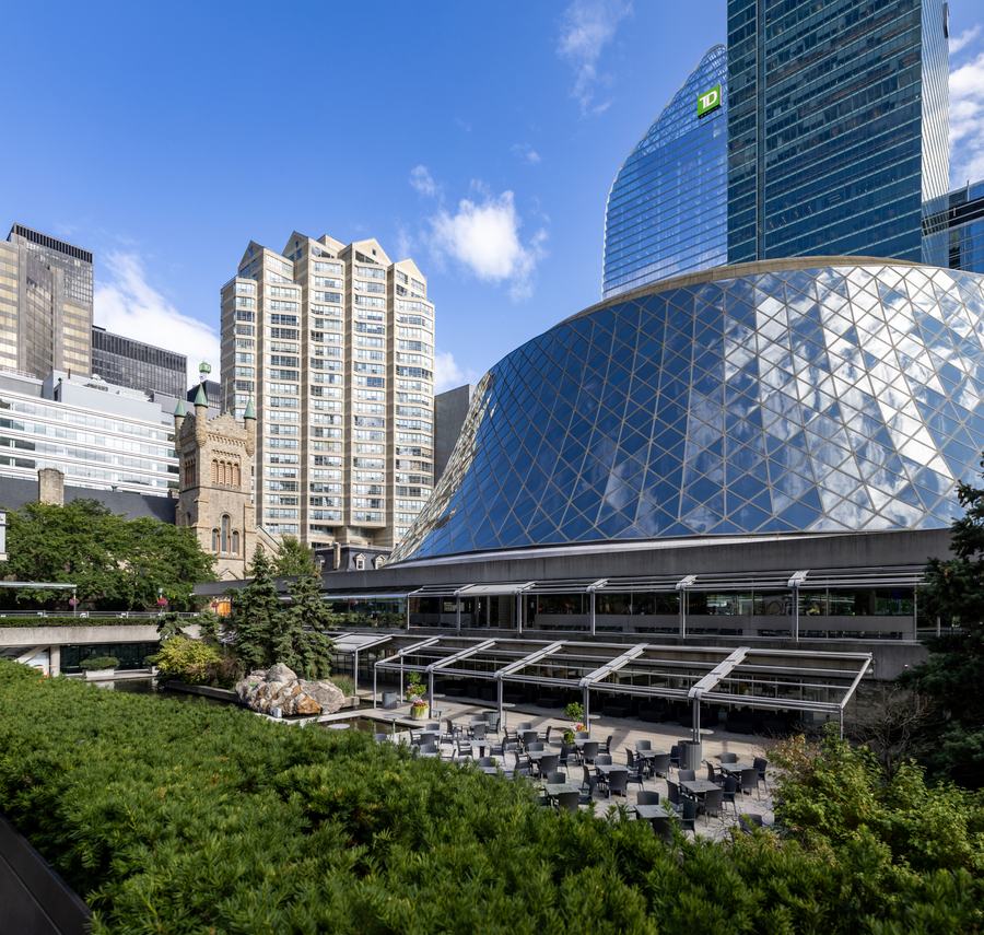 Roy Thomson Hall's sloping glass-and-steel dome, with downtown Toronto towers behind